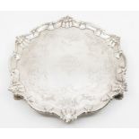 A George II silver salver, raised border with rocaille decoration, the reserve engraved with a