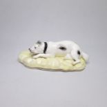 A Staffordshire Samuel Alcock porcelain  Mastiff laying on a yellow rocky base with a gilt rim