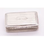 A William IV silver snuff box, engine turned with Regency stripes, reeded sides, ornate foliate