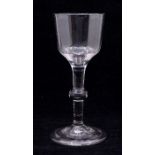 An 18th Century wine glass, plain bowl above single knop stem, on stepped conical base, 15cm