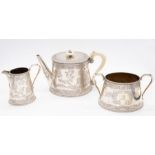 A Victorian matched three piece Aesthetic silver tea service to include teapot, sugar bowl and