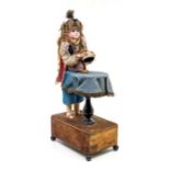 Renou: A late 19th century, magician automaton Victorian doll by Renou, with bisque head, marked