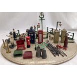 Dinky: A collection of assorted Dinky and Britains garage and street accessories to include: