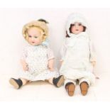 Dolls: A pair of bisque head dolls to comprise: Hermann Steiner with composition body, open and