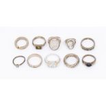 A selection of ten silver and white metal rings. Comprising a rutilated quartz statement ring; a