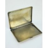 Silver and yellow metal Art Deco cigarette case with engine turned decoration.