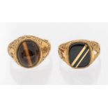 Two 9ct gold gem set gentlemen's rings. One set with black onyx with gold bands inlaid, size P; plus