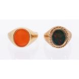 Two 9ct gold signet rings. One set with bloodstone, surrounded by twisted wire, size R. The other