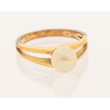 A cultured pearl set yellow metal ring, with split shoulders. Stamped 585. Size N 1/2. Gross