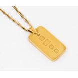 A 9ct gold ingot pendant on a 9ct gold curb chain. The Ingot features hallmarks for KMJ, London,