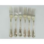 Six 19th century silver fiddle and thread pattern table forks with hawk crest engravings