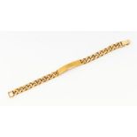 A 9ct yellow gold heavy gauge identity bracelet. Approximately 20cms long. Approximate weight 52.3