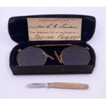 A 9ct gold cased small pen knife, along with a pair of yellow metal pince nez glasses in case. The