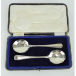 Pair of fluted silver serving spoons in fitted case. Fully hallmarked Sheffield 1921