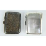 Two antique silver cigarette cases one machine turned, the other with engraved decoration.