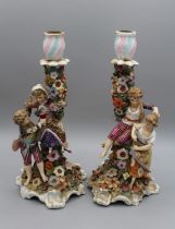 A pair of 19th century Derby porcelain figural candlesticks, each modelled with a young boy and girl