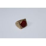 A 20th century 9ct gold carnelian intaglio ring, carved with profile of a soldier, to broad textured