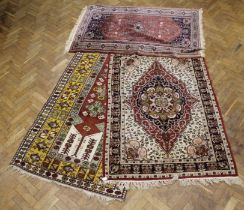 A Turkish style hand knotted rug having a saffron border, 220 x 121cm, a North West Persian style