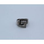 Geometric retro style 9ct white gold ring set with black and white diamonds. Diamonds total