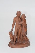 A 19th century terracotta figure group, a partially draped Classical nude couple with attendant