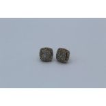 Pair of 9ct yellow gold diamond cluster ear studs, boxed. with an estimated 1.00 carat of round