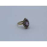 A 9ct gold marquise cut amethyst and pearl set ring. Size K 1/2, 2.7grams approximately