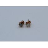 A pair of 0.65 carat (total estimated weight) diamond earrings in 18ct rose gold 4 claw setting