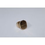 A gold signet ring, with simple cross motif. Stamped 9ct, 12gms, size T
