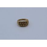 An 18ct keeper ring, size M, 6 grams approximately