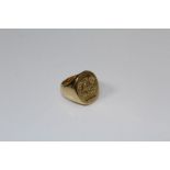 An 18ct gold signet ring with ribbons and cross coronet device, to a plain shank, 21gm gross weight,