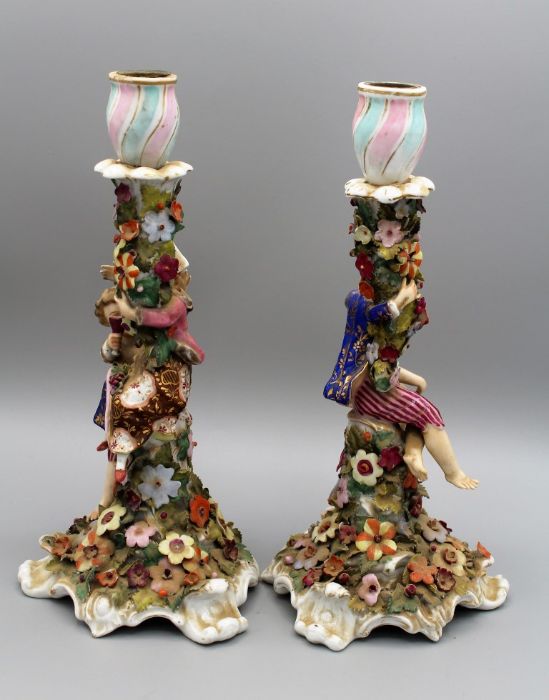 A pair of 19th century Derby porcelain figural candlesticks, each modelled with a young boy and girl - Image 4 of 5