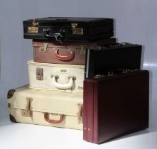 A mid 20th century Foxcroft suitcase, two smaller suitcases and three briefcases