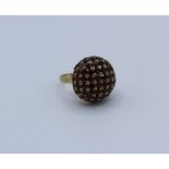 A 9ct gold garnet set bombe ring, size M, 7.5 gm approximately