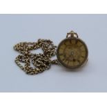 A 14k stamped key winding pocket watch with open dial and yellow metal chain