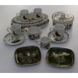 A large Portmeirion pottery table set having dinner plates, side plates, serving dishes, mugs and