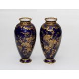 A pair of early 20th century Royal Crown derby vases of baluster ovoid form, each richly gilt