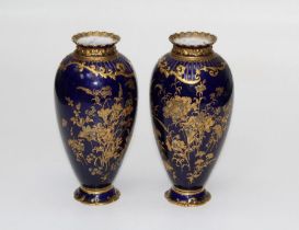A pair of early 20th century Royal Crown derby vases of baluster ovoid form, each richly gilt