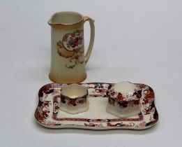A Derby Crown Ware Imari pattern dressing table tray, two conforming boxes and a Devon type water