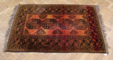 An Ersari large rug, the orange red guard with four large guls, 177 x 120cm