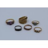 A collection of 9ct gold, yellow metal and 925 rings, featuring a 9ct gold keeper ring, 1.7 grams