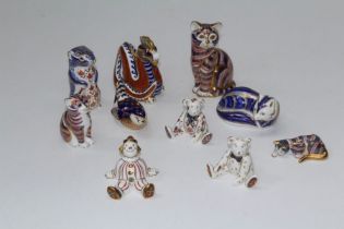 A collection of eight Royal Crown Derby Imari paperweights including Dragon, Squirrel, two cats
