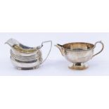 A George III silver milk jug, gadroon rim, gilt interior, hallmarked by Michael Starkey, London,