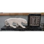 An Art Deco style clock with attendant white panther