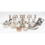 A small collection of silver plated items to include; two candelabra, an elaborate plated epergne/