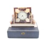 An Art Deco Smith's presentation desk clock, held within blue john and agate? geometric case, with