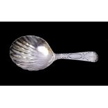 A George III silver caddy spoon, shell shaped bowl, engraved decorated handle and initialled