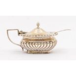 A Georgian style silver gadrooned mustard pot and cover, hallmarked by Jay, Attenborough & Sons.,