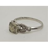 A platinum and diamond ring, set central round brilliant cut diamond to centre (EDW 0.85 carats) and