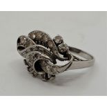 A platinum diamond dress ring, c.1930's, pave set graduated round brilliant cut and channel set