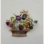 A 9ct. gold and gemstone set jardinière brooch, fashioned as a basket of flowers set numerous seed